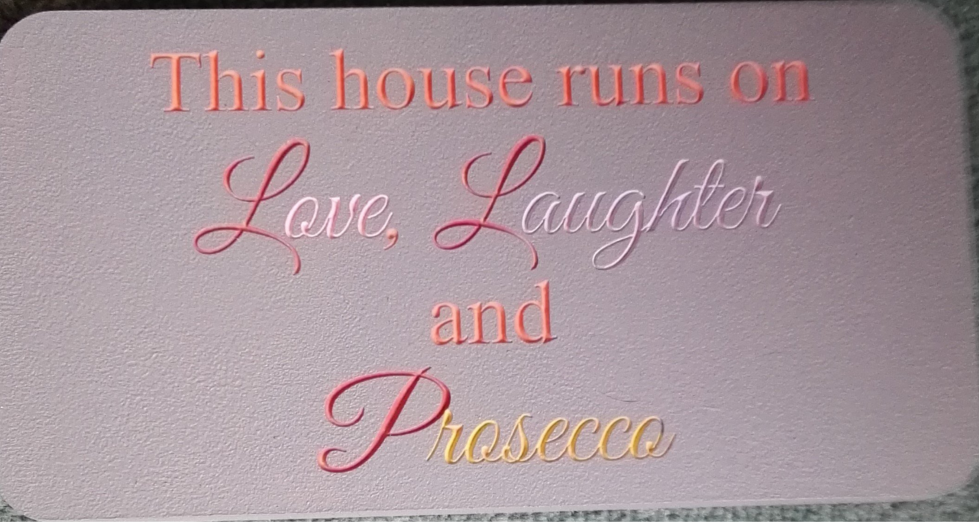 This house runs on love ,laughter and prosseco freestanding plaque