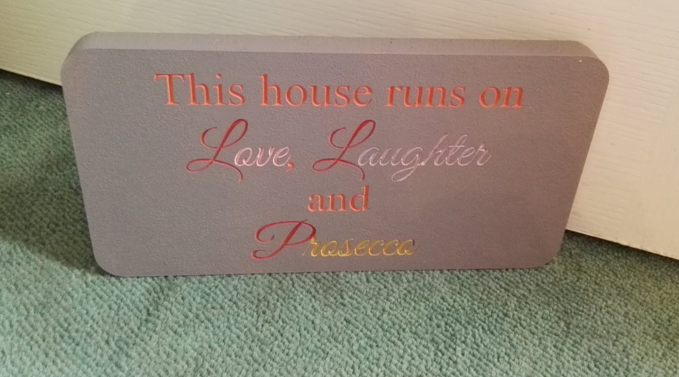 This house runs on love ,laughter and prosseco freestanding plaque